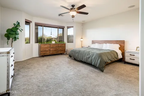 a living room with a bed furniture and a window
