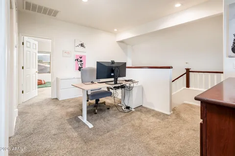 a view of a workspace with furniture