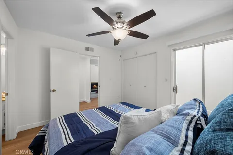 a living room with furniture and a ceiling fan