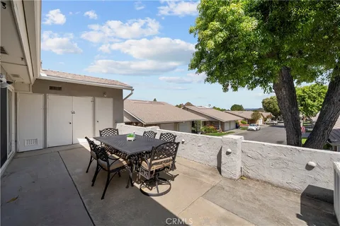 a terrace of a house with outdoor seating
