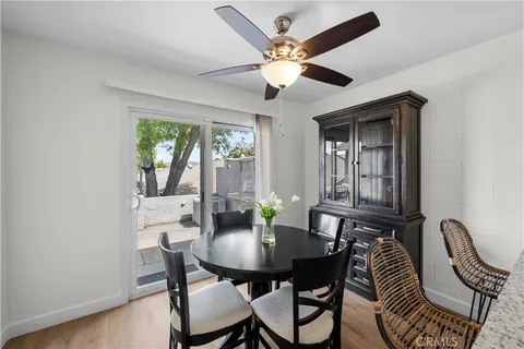 a view of a dining room with furniture and window
