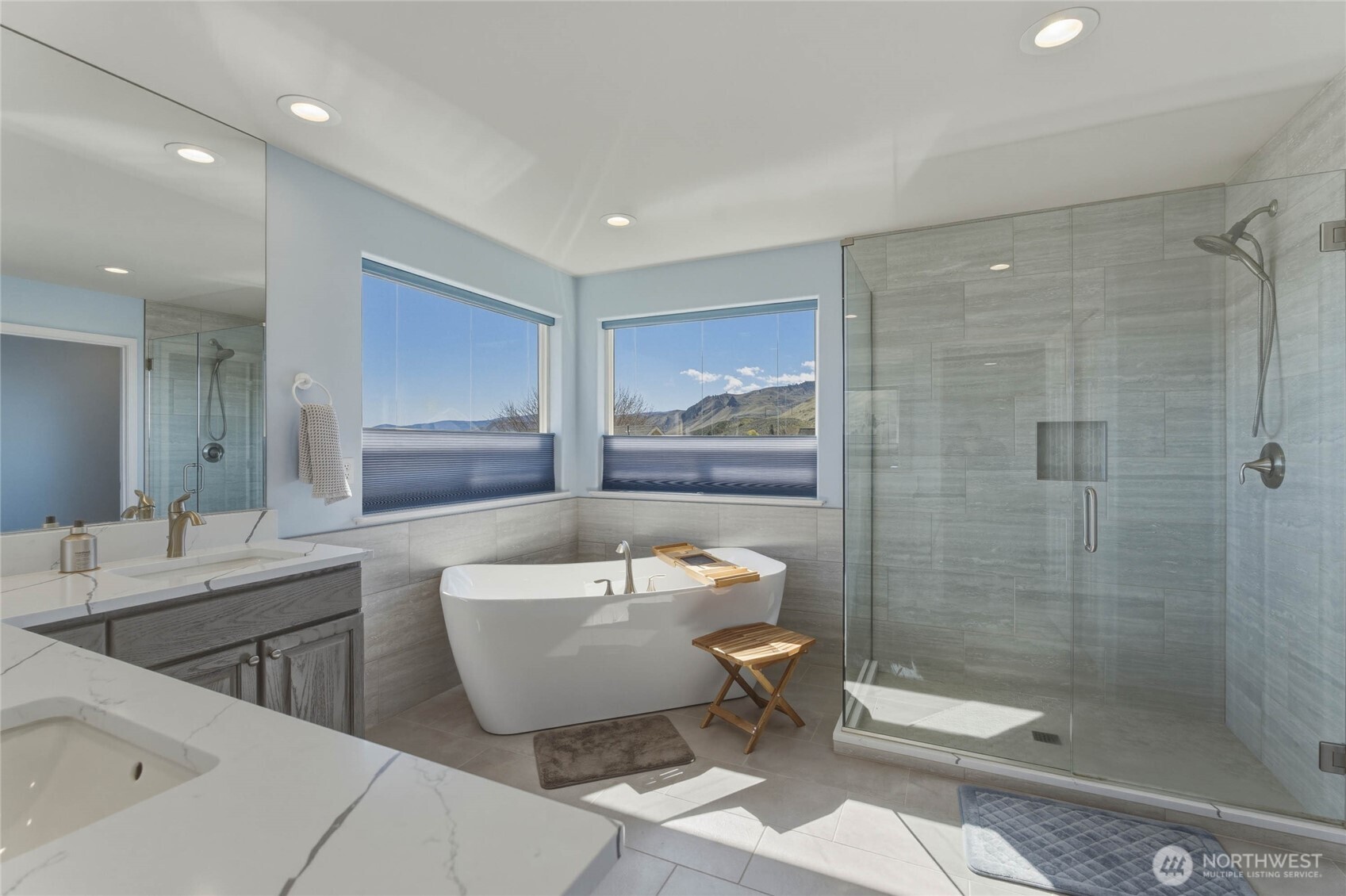 2217 Michael Brooke Wenatchee, WA 98801 - Photo 28 of 37 a bathroom with a double vanity sink toilet mirror and bathtub