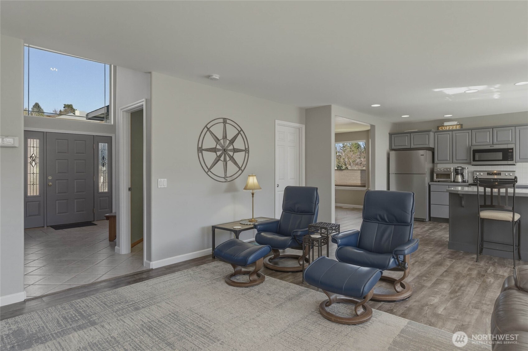 2217 Michael Brooke Wenatchee, WA 98801 - Photo 10 of 37 a living room with furniture a clock on wall and a window
