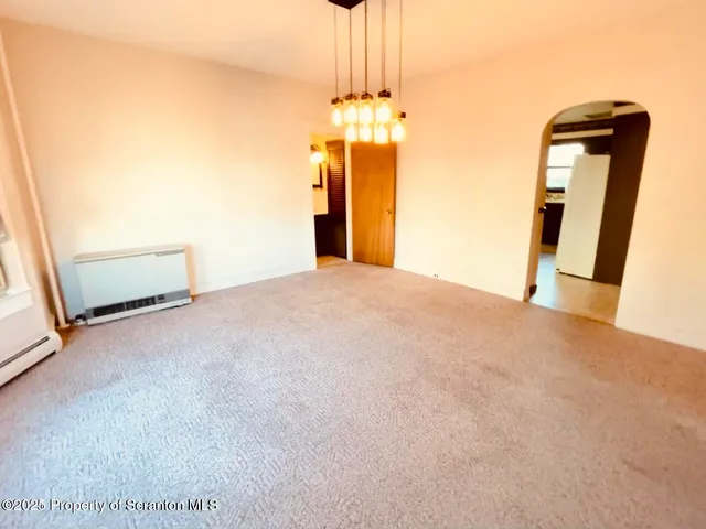 a spacious bathroom with a sink a mirror and a bathtub next to a window