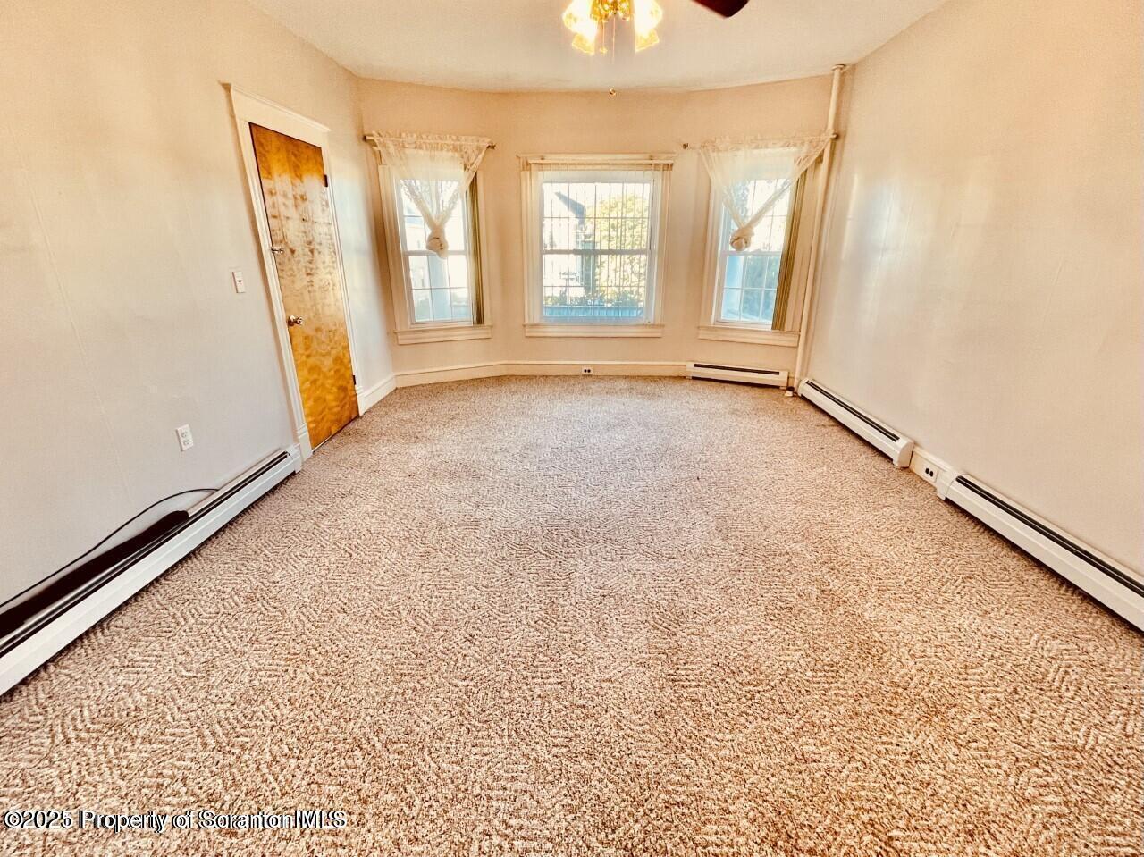 1630 Myrtle Street, Unit 1 Scranton, PA 18510 - Photo 5 of 25 an empty room with windows