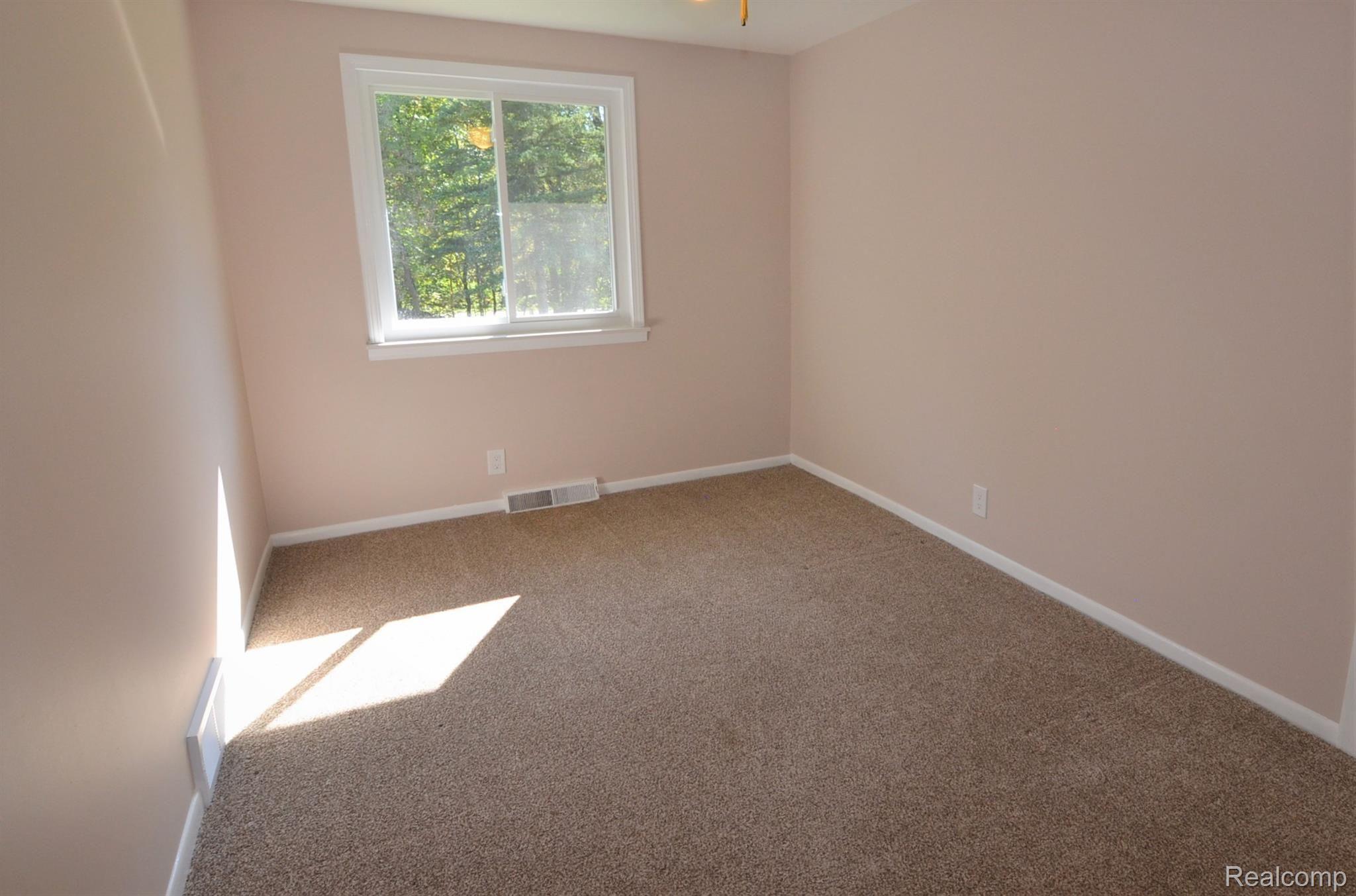 1597 East Rattalee Lake Road Holly, MI 48442 - Photo 23 of 26 LARGE PEACEFUL BEDROOMS