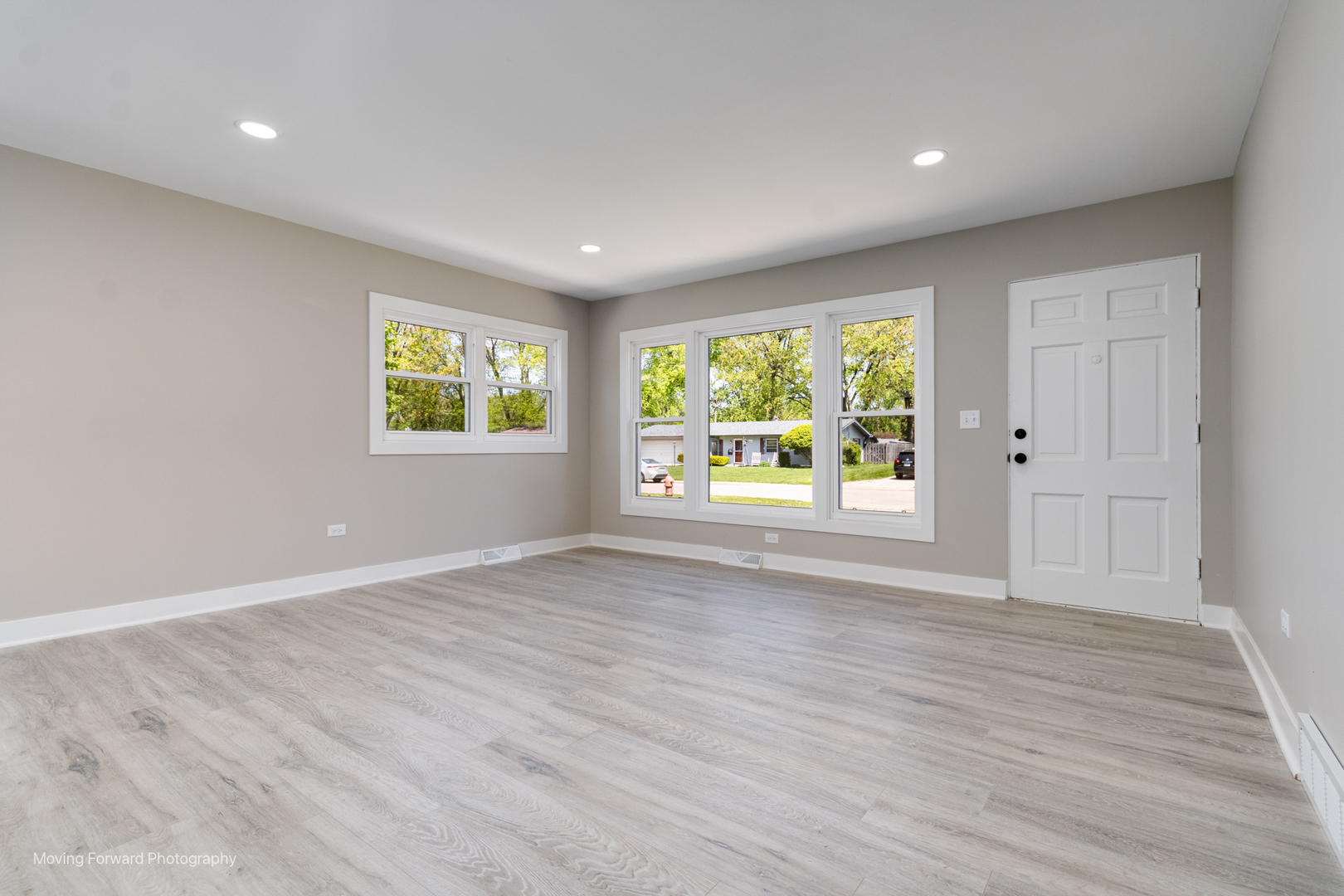 11 Durango Road Montgomery, IL 60538 - Photo 14 of 36 an empty room with wooden floor and windows