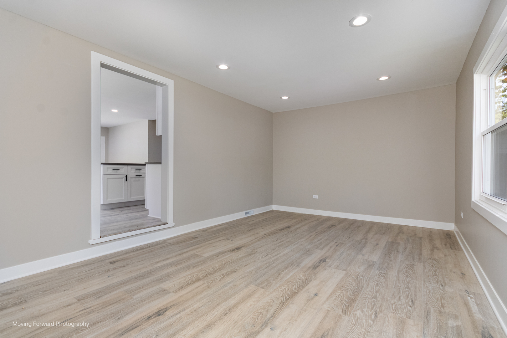 11 Durango Road Montgomery, IL 60538 - Photo 17 of 36 an empty room with wooden floor and windows