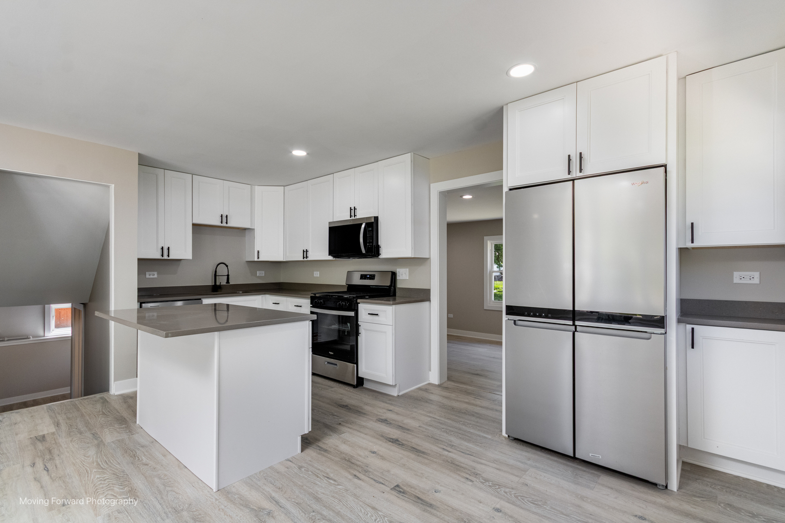 11 Durango Road Montgomery, IL 60538 - Photo 8 of 36 a kitchen with a refrigerator a sink and cabinets