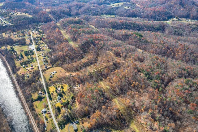 an aerial view of residential house and sandy dunes