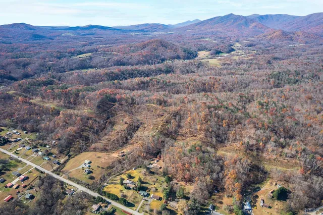 a view of a mountain in the distance in a field