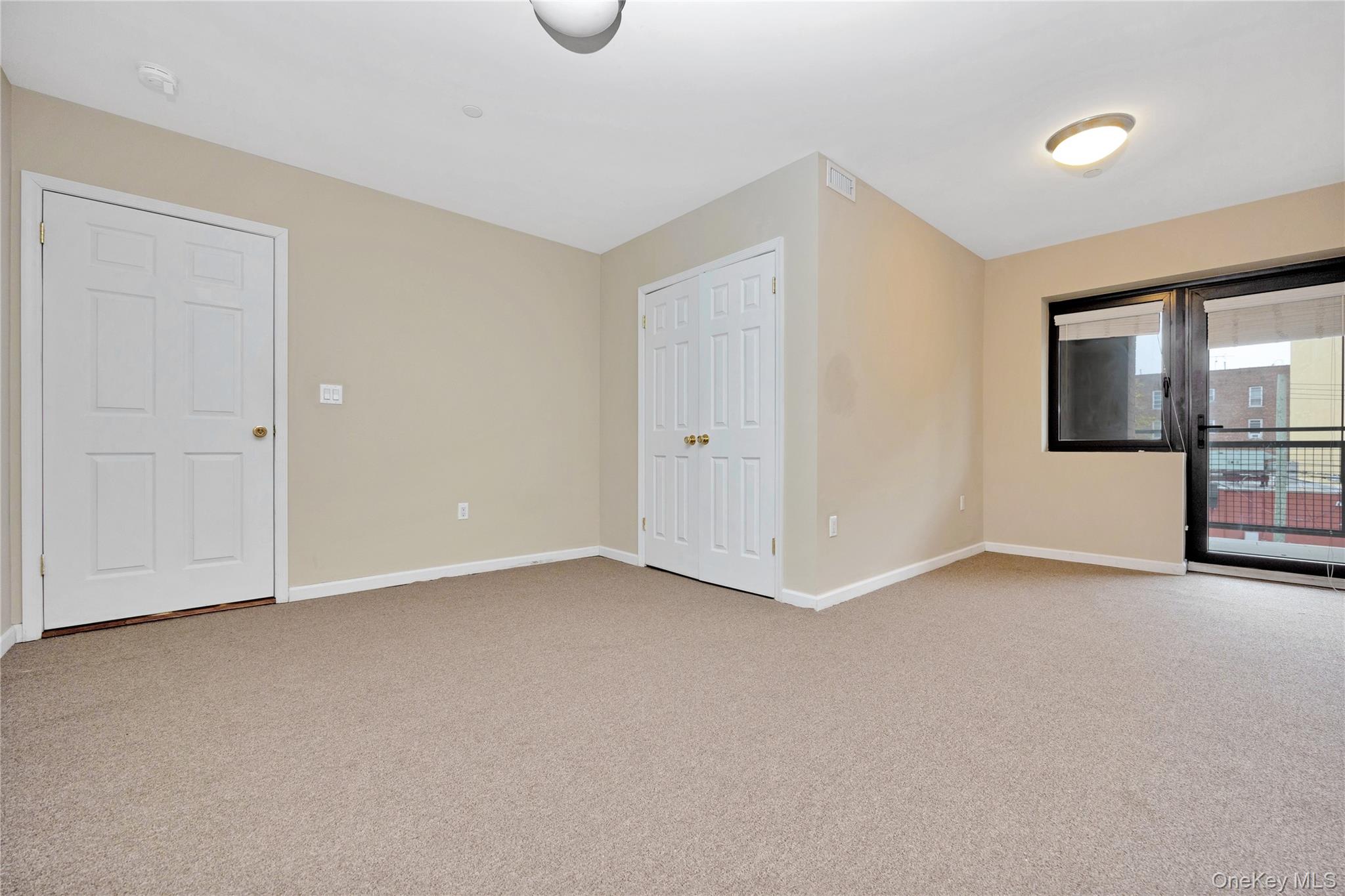 172-18 Jamaica Avenue, Unit 501 Queens, NY 11432 - Photo 11 of 27 a view of an empty room with a window