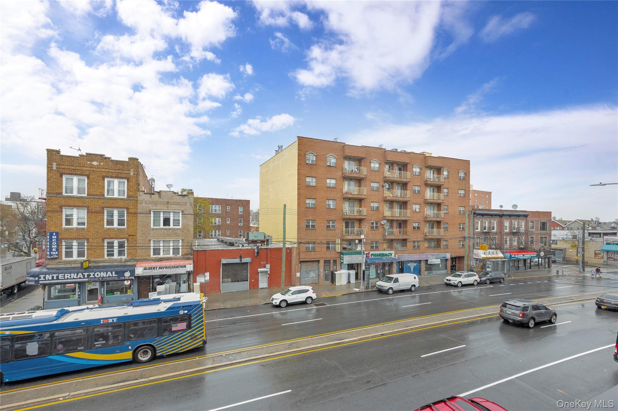 172-18 Jamaica Avenue, Unit 501 Queens, NY 11432 - Photo 19 of 27 a city street lined with buildings and cars