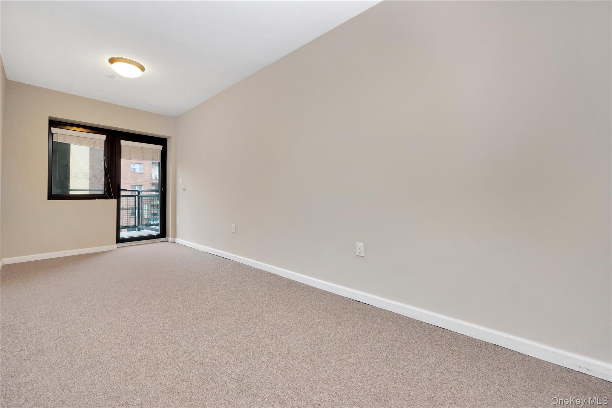 172-18 Jamaica Avenue, Unit 501 Queens, NY 11432 - Photo 9 of 27 an empty room with windows