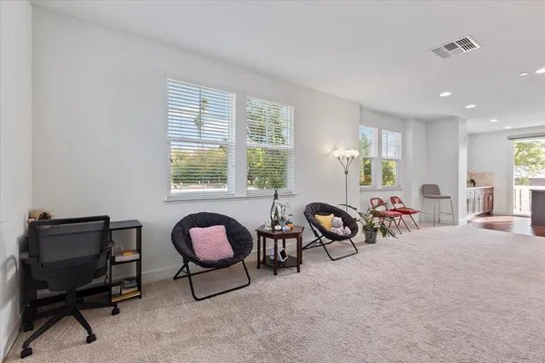 a view of a livingroom with furniture and windows