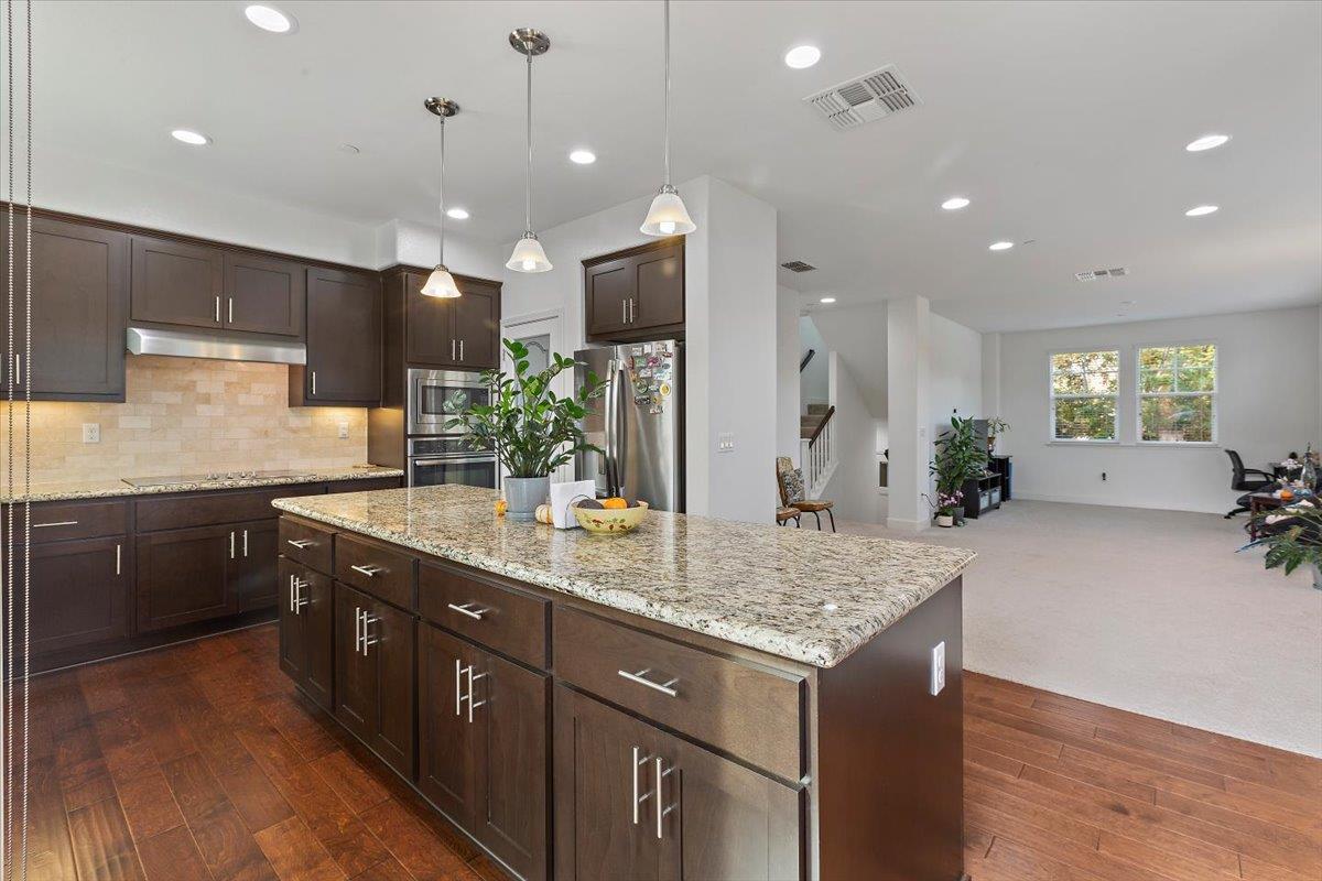 2041 Atlas Loop Mountain View, CA 94043 - Photo 2 of 51 a kitchen with a sink center island and cabinets