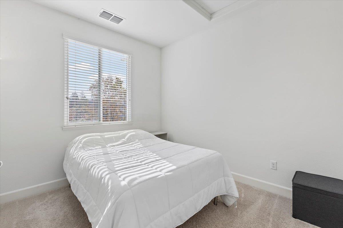2041 Atlas Loop Mountain View, CA 94043 - Photo 29 of 51 a bedroom with a bed and a window