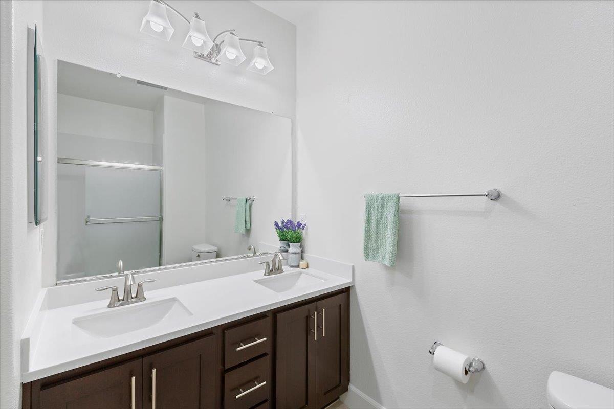 2041 Atlas Loop Mountain View, CA 94043 - Photo 30 of 50 a bathroom with a double vanity sink a toilet and a mirror