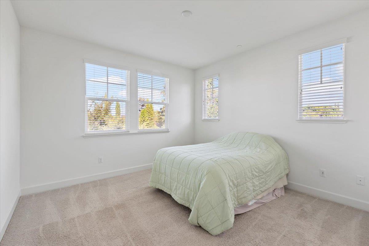 2041 Atlas Loop Mountain View, CA 94043 - Photo 32 of 51 a bed sitting in a bedroom next to a window