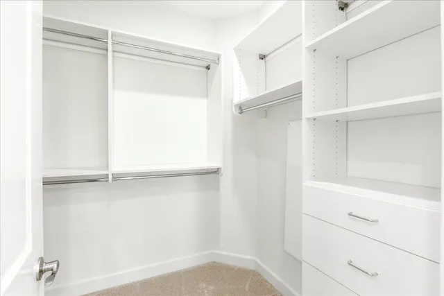 a view of an empty walk in closet