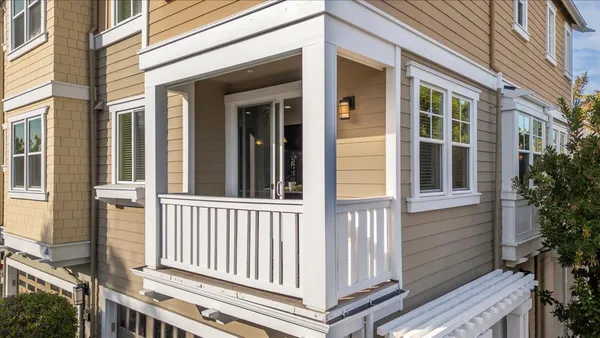 a view of a house with porch and wooden floor