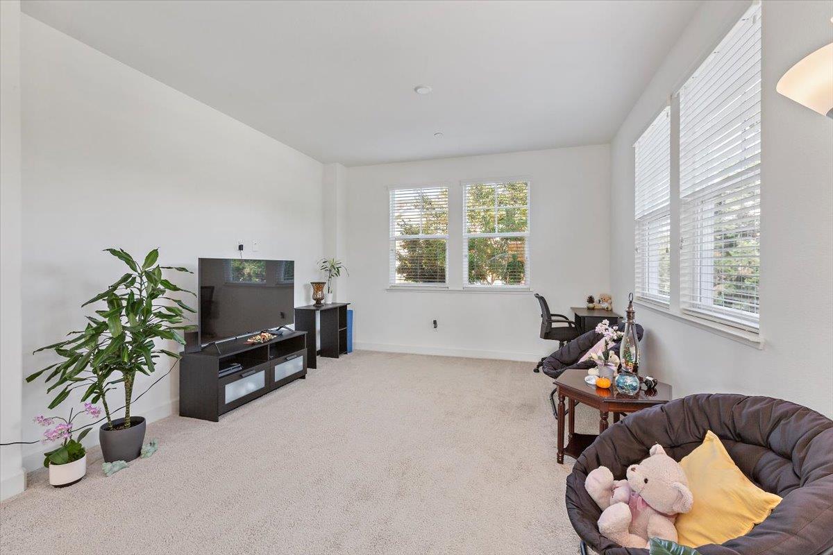 2041 Atlas Loop Mountain View, CA 94043 - Photo 9 of 50 a living room with furniture and a potted plant