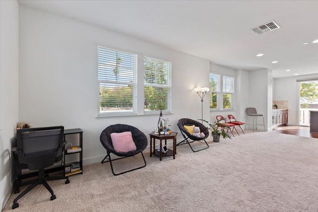 a view of a livingroom with furniture and windows
