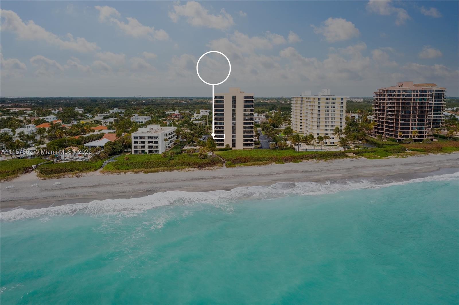 450 Ocean Drive, Unit 305 Juno Beach, FL 33408 - Photo 30 of 30 a view of a house with a yard and garage