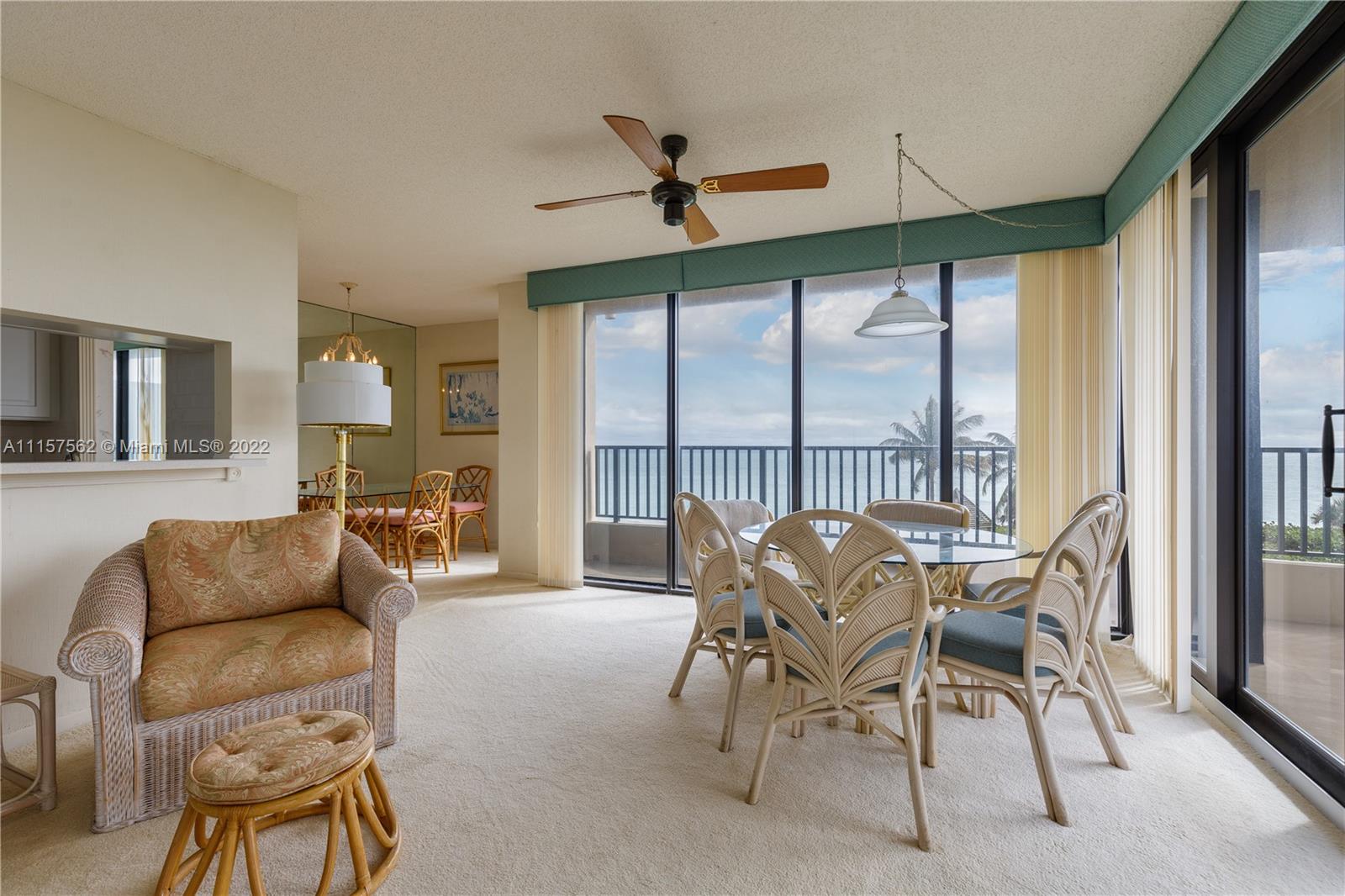 450 Ocean Drive, Unit 305 Juno Beach, FL 33408 - Photo 8 of 30 a living room with furniture and a large window