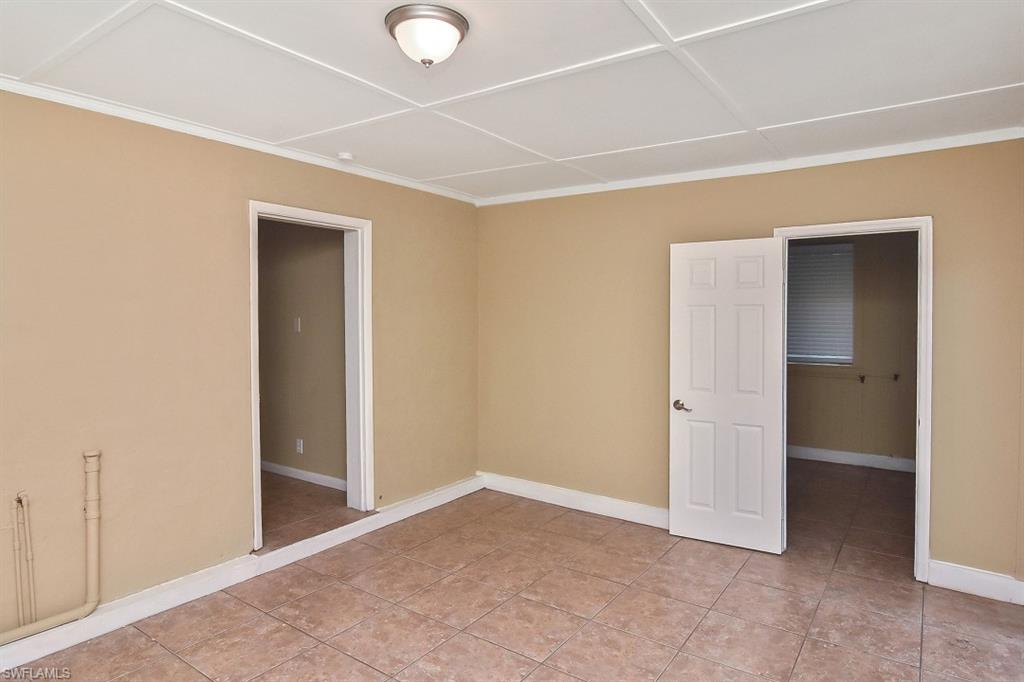 3966 Madison Avenue Fort Myers, FL 33916 - Photo 11 of 22 an empty room with closet and a bathroom