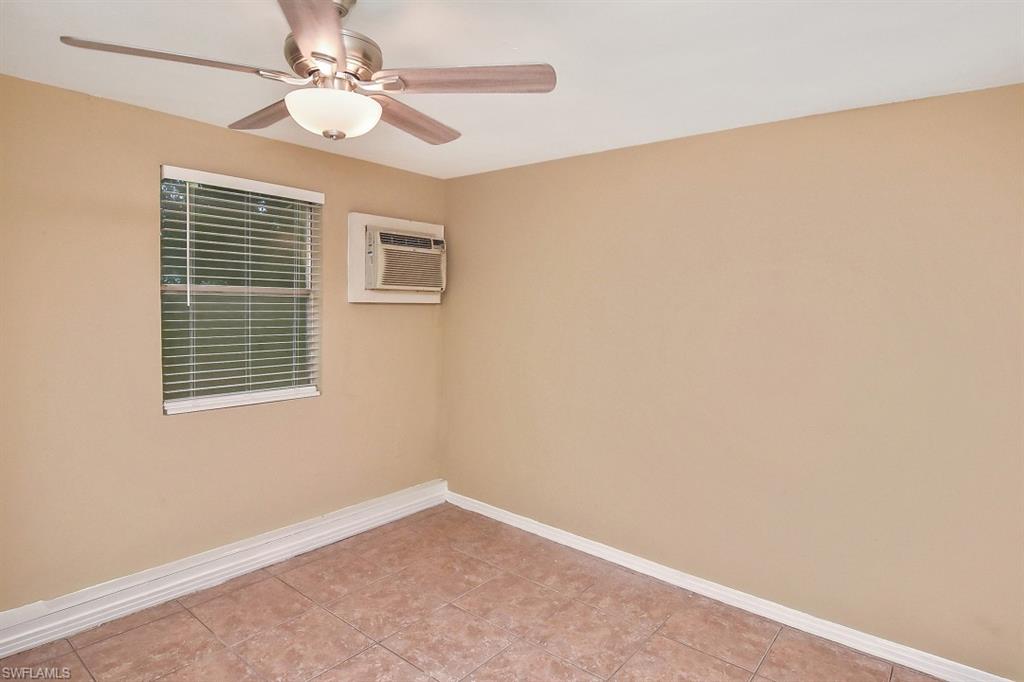 3966 Madison Avenue Fort Myers, FL 33916 - Photo 15 of 22 an empty room with a window and a fan