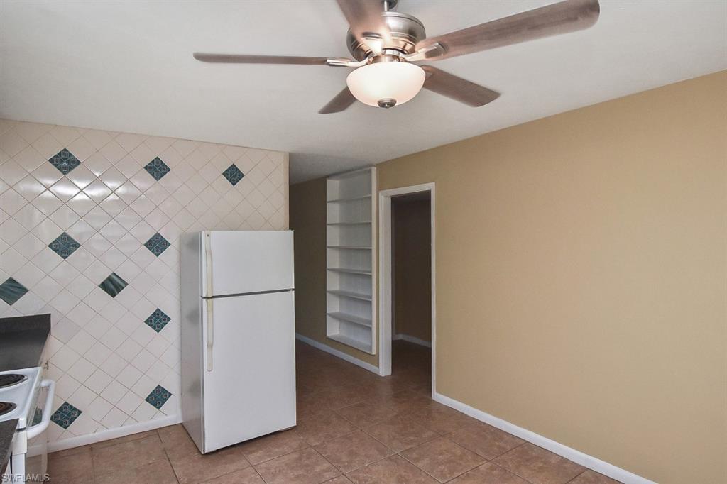 3966 Madison Avenue Fort Myers, FL 33916 - Photo 17 of 22 a white refrigerator freezer cabinets and ceiling fan