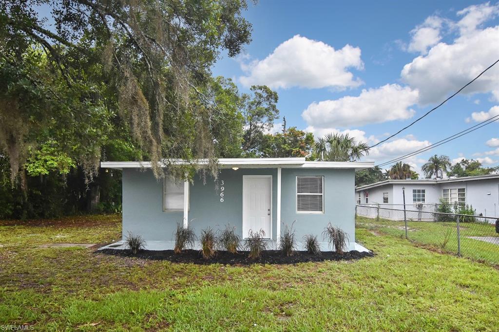 3966 Madison Avenue Fort Myers, FL 33916 - Photo 19 of 22 a backyard of a house with lots of green space