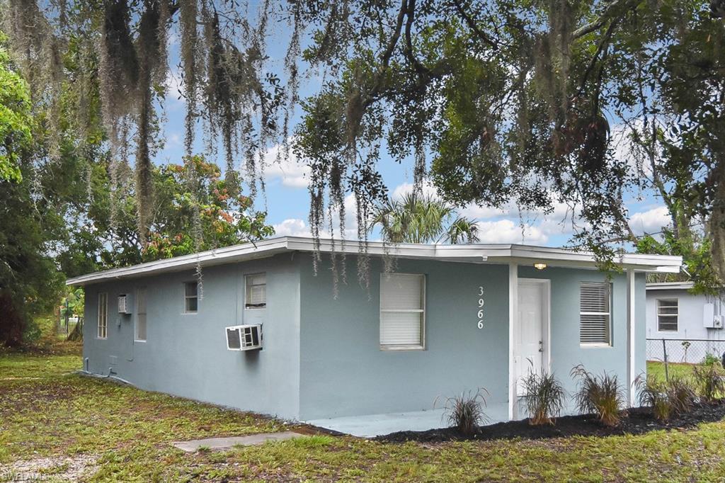 3966 Madison Avenue Fort Myers, FL 33916 - Photo 3 of 22 a view of a house with a yard