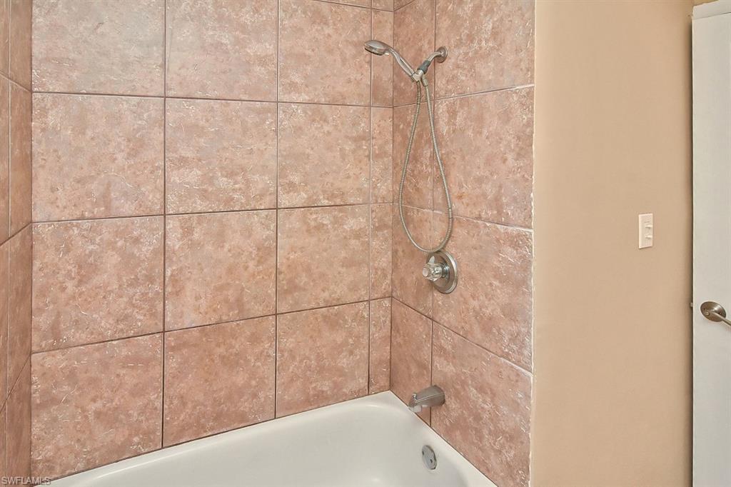 3966 Madison Avenue Fort Myers, FL 33916 - Photo 6 of 22 a bathroom with a bathtub