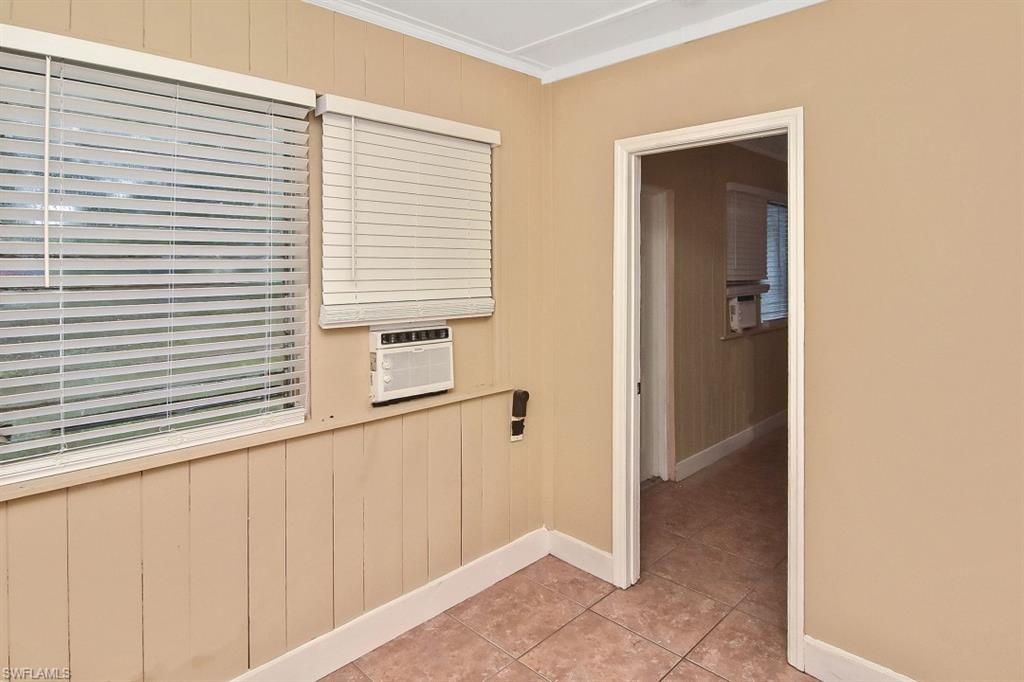 3966 Madison Avenue Fort Myers, FL 33916 - Photo 8 of 22 a view of a hallway with a white door