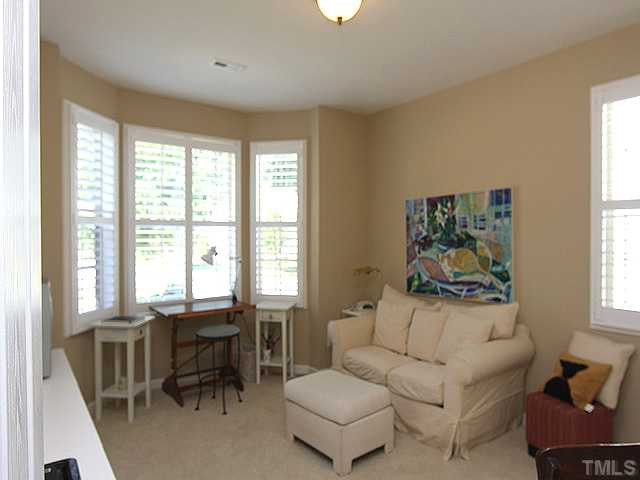 6153 Blakeman Lane Raleigh, NC 27617 - Photo 9 of 12 Second bedroom with bay window, plantation shutters, and adjacent bath. Bedroom