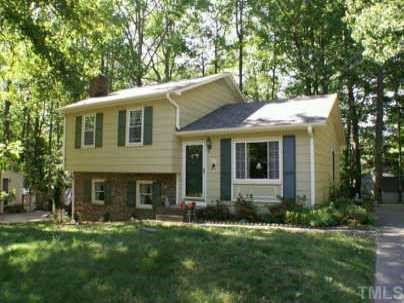 1105 Terrace Court Raleigh, NC 27615 - Photo 1 of 12 a front view of a house with a garden