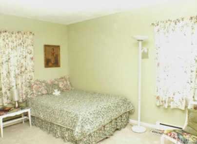 1105 Terrace Court Raleigh, NC 27615 - Photo 7 of 12 a bedroom with a bed and a bathroom