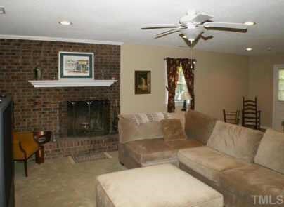 1105 Terrace Court Raleigh, NC 27615 - Photo 9 of 12 a living room with furniture and a fireplace