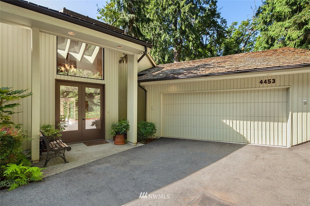 4453 East Mercer Way Mercer Island, WA 98040 - Photo 2 of 25 a view of a house with a wooden door and glass door