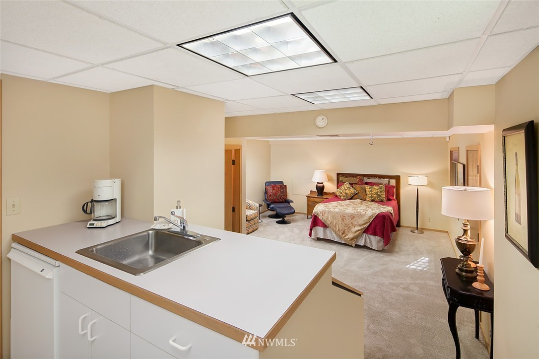 4453 East Mercer Way Mercer Island, WA 98040 - Photo 23 of 25 a bedroom with a bed and a mirror