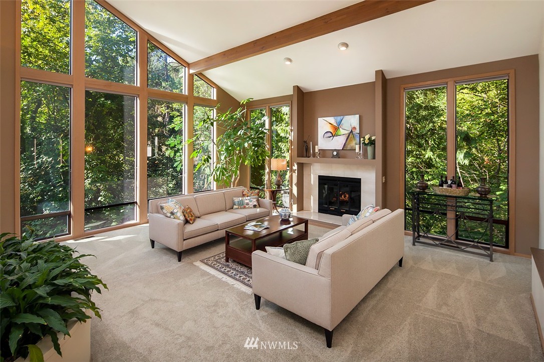 4453 East Mercer Way Mercer Island, WA 98040 - Photo 4 of 25 a living room with furniture large window and fireplace