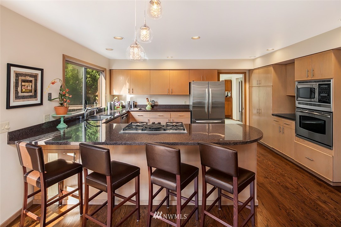 4453 East Mercer Way Mercer Island, WA 98040 - Photo 8 of 25 a view of a dining room with furniture window and outside view
