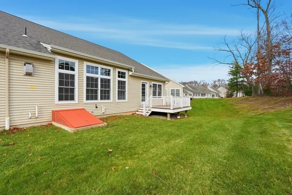 a front view of a house with yard and porch