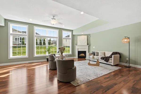 a living room with furniture and a fireplace