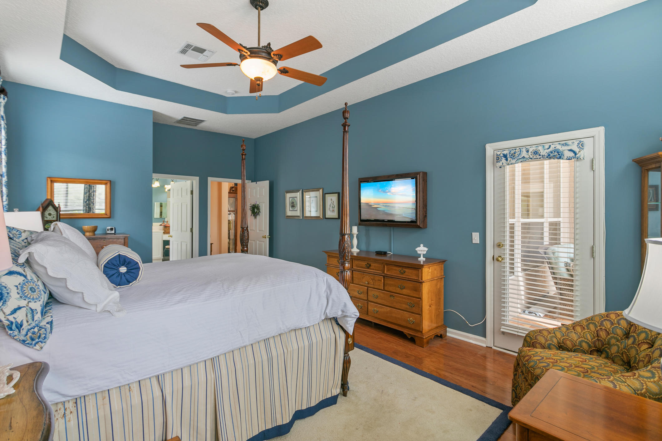 1508 Hackberry Court St. Johns, FL 32259 - Photo 17 of 47 a bedroom with a bed and dresser with mirror