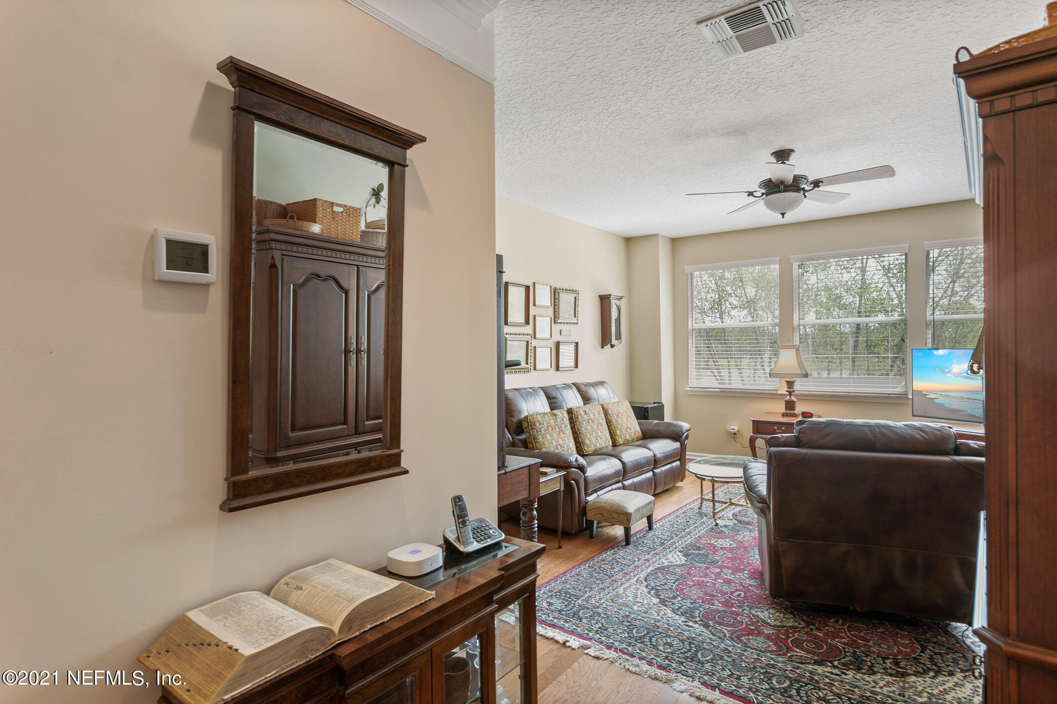 1508 Hackberry Court St. Johns, FL 32259 - Photo 21 of 47 a living room with furniture a fireplace and a table