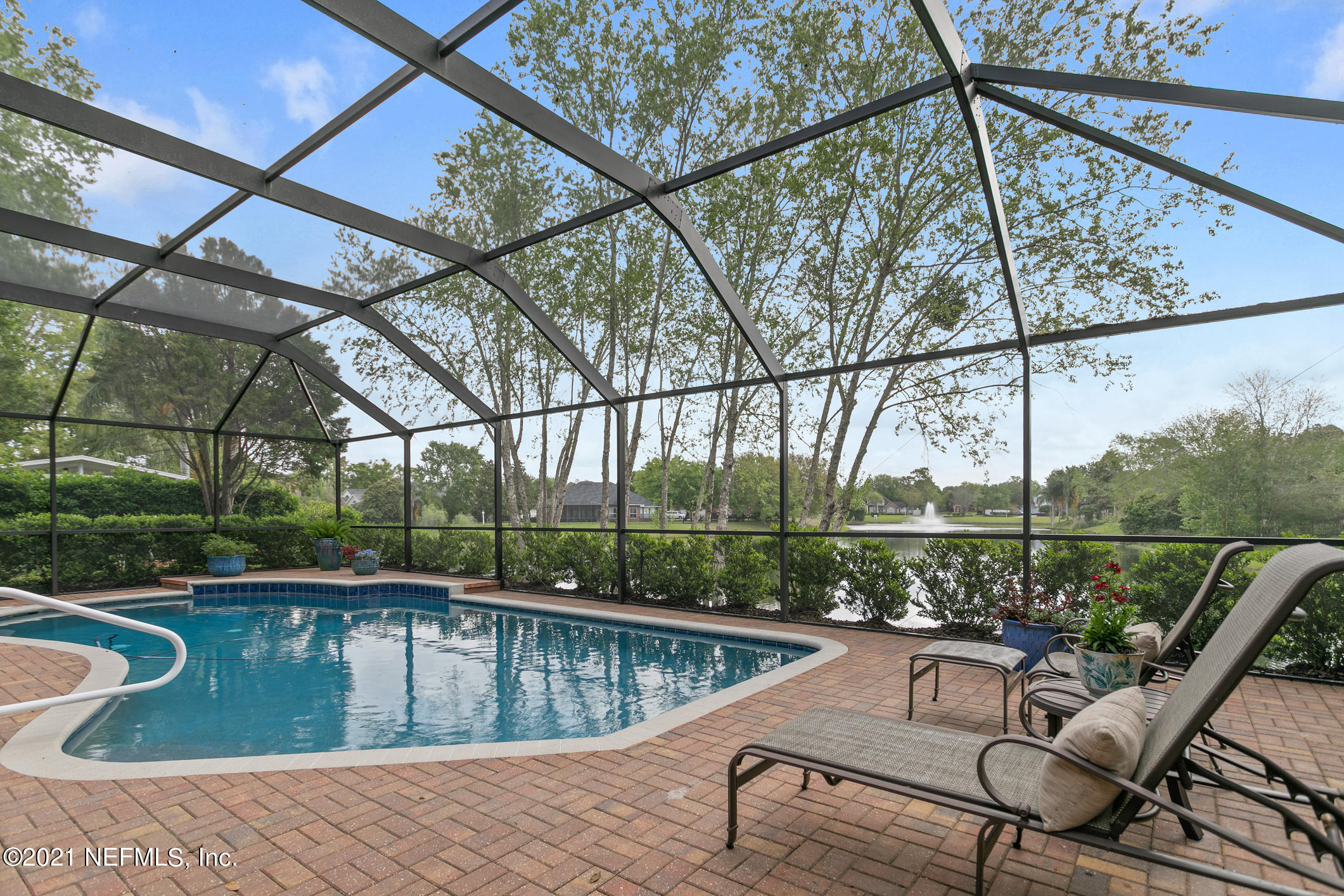 1508 Hackberry Court St. Johns, FL 32259 - Photo 33 of 47 a view of a swimming pool with a patio and a yard