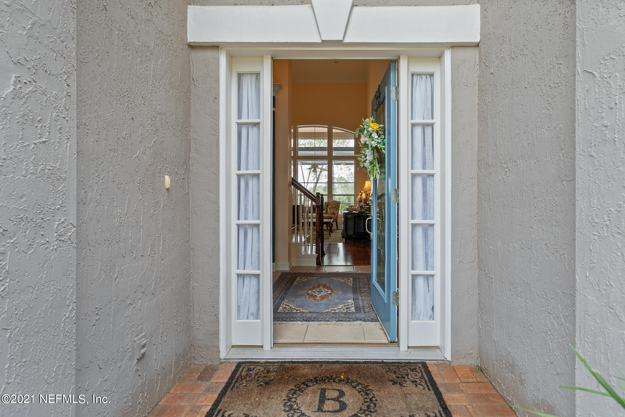 1508 Hackberry Court St. Johns, FL 32259 - Photo 4 of 47 a view of a hallway with a glass door and a window